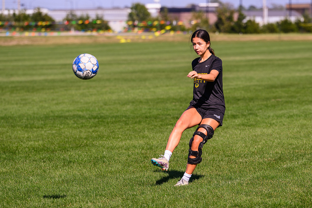 A photo of a girl playing soccer.