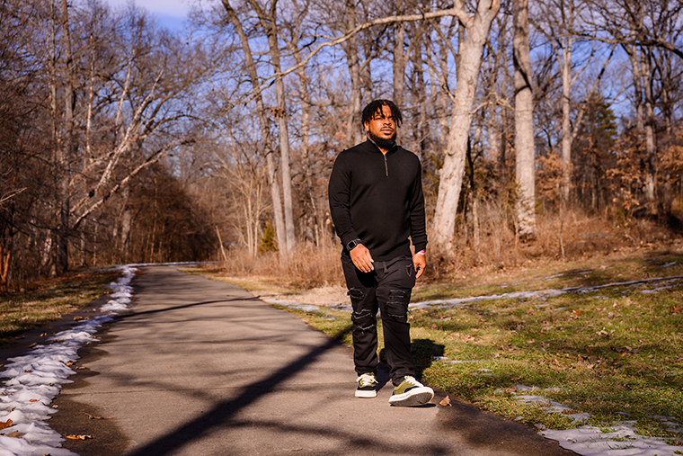 Shawn Nesbitt walks through a park near his home in Jefferson City, something he has done nearly every day since suffering a heart attack in 2023.