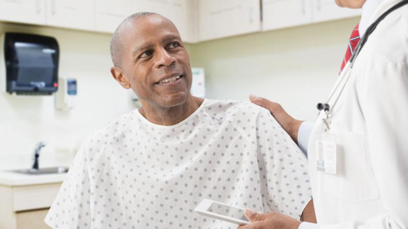 A male patient speaking with his doctor.