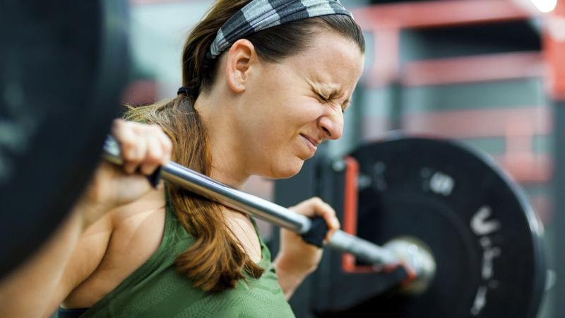 A woman lifting weights.