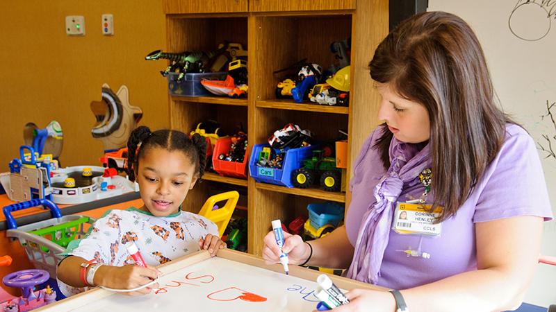 Child Life Therapist with patient