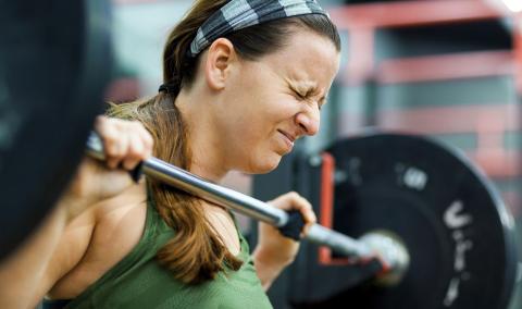 A woman lifting weights.