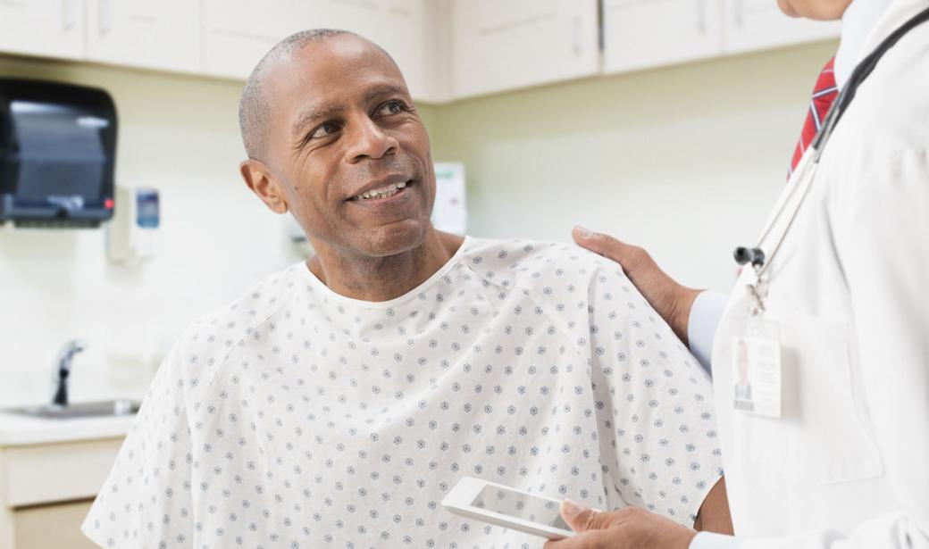 A male patient speaking with his doctor.